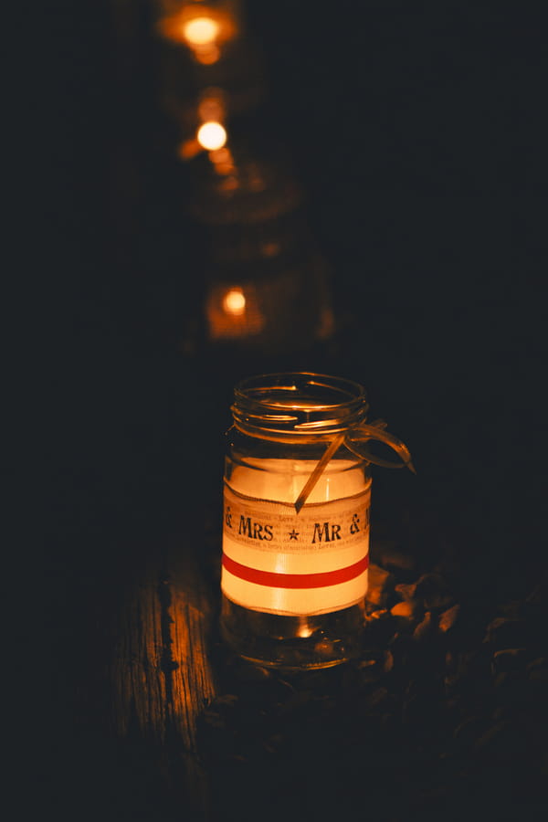 Jam jar with candle in