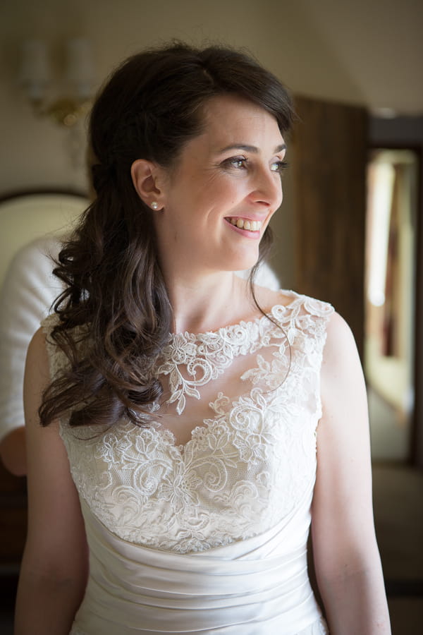Bride wearing lace detailed dress