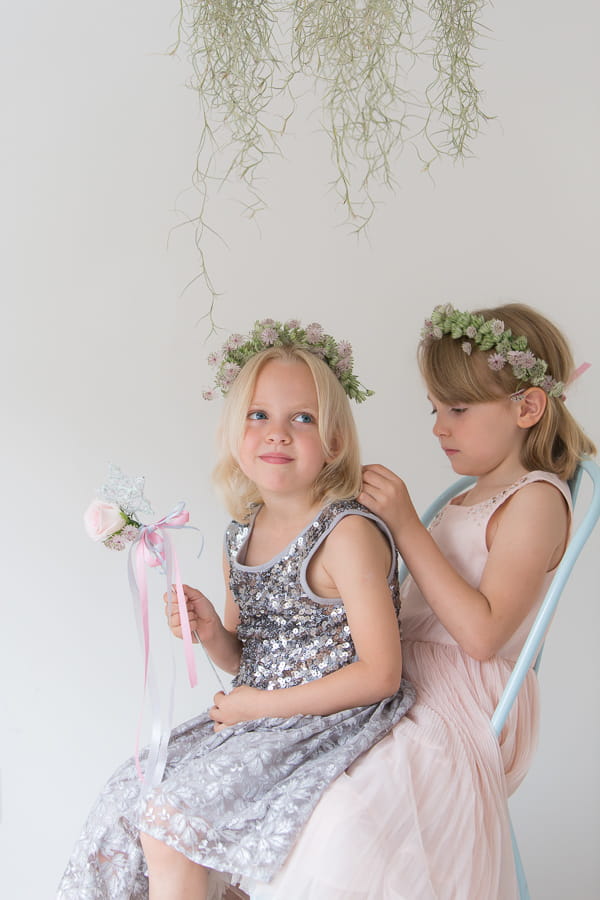 Flower girls sitting on a chair