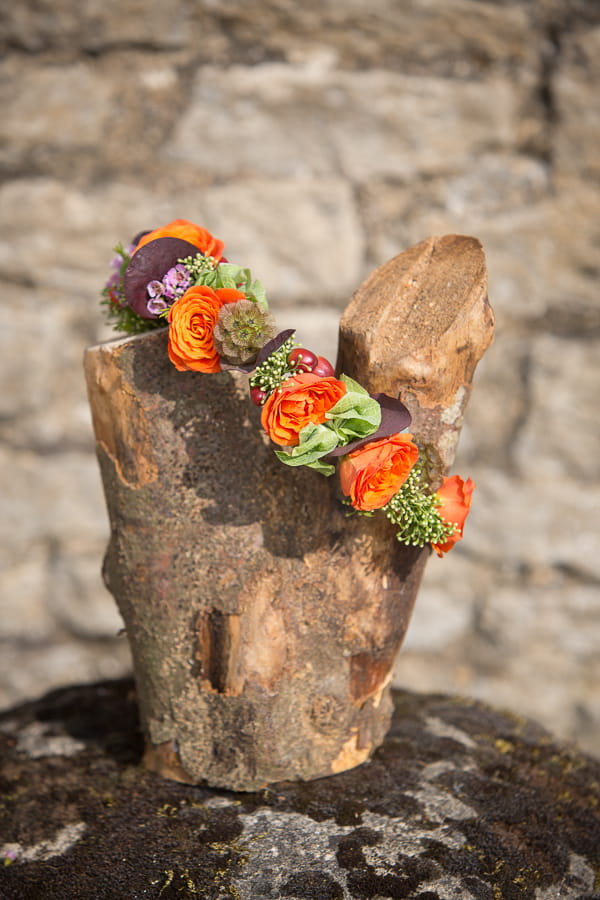 Log with wedding flowers