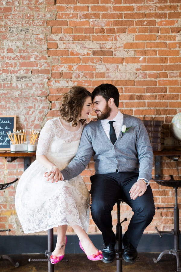 Couple sitting holding hands