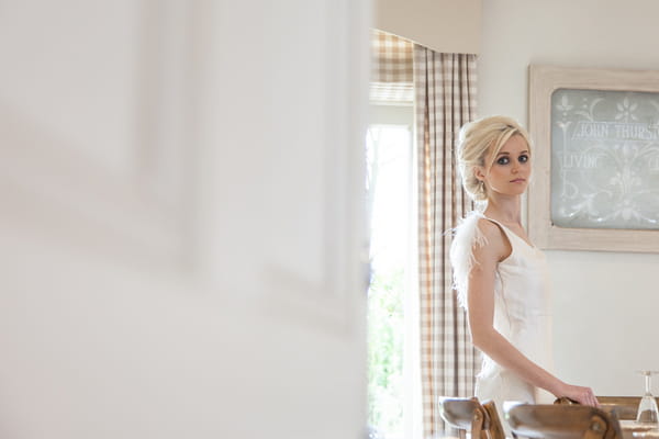 Bride standing at table