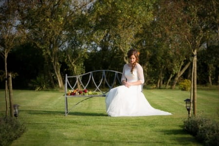 Bride sitting on bench