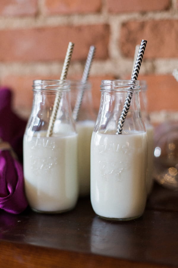 Bottles of milk with straws