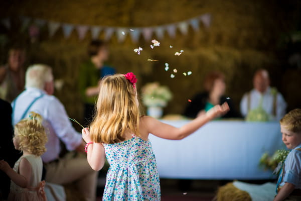 Young girl throwing confetti