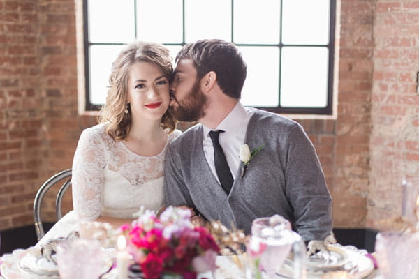 Man kissing woman on cheek