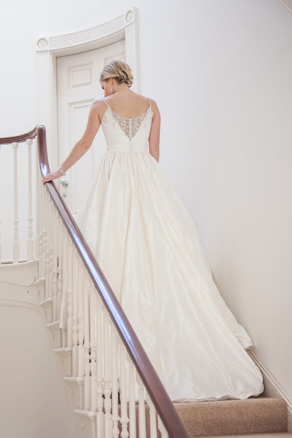 Bride walking up stairs