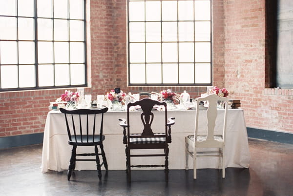 Wedding table with mismashed chairs