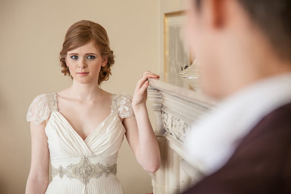 Bride looking across at groom