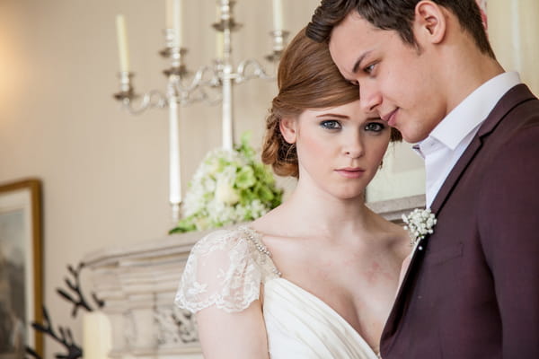 Bride and groom resting heads on each other