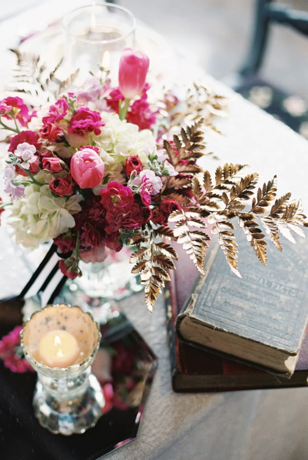 Flowers and books on wedding table