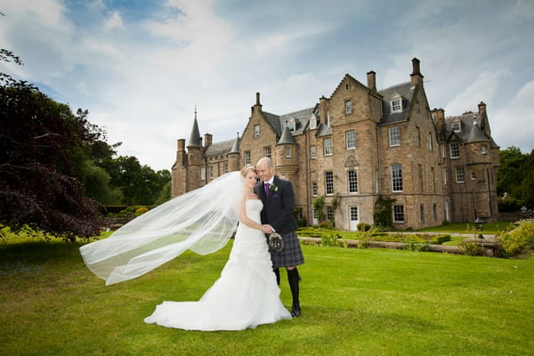 Bride and groom outside Carberry Tower