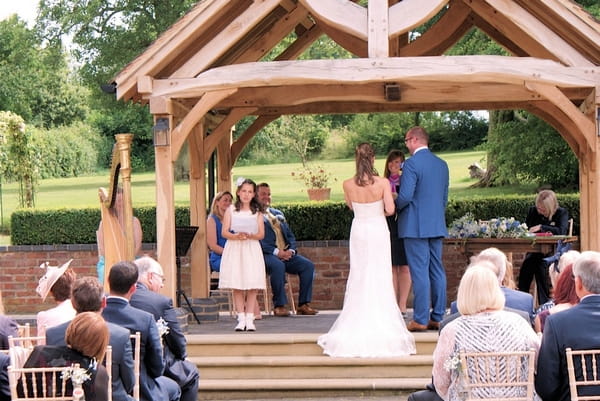 Michelle Dalton Playing the Harp at Outdoor Wedding Ceremony