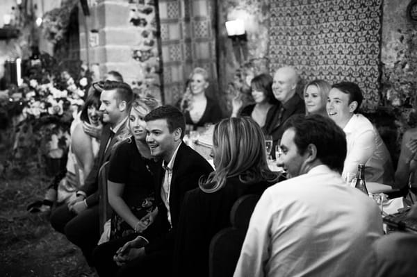 Wedding guests listening to speech