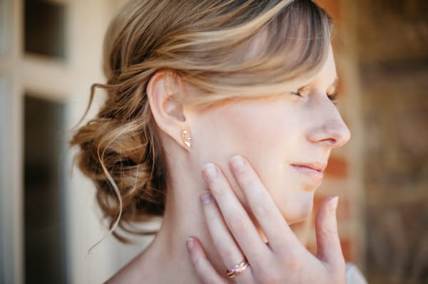 Bride with hand on face