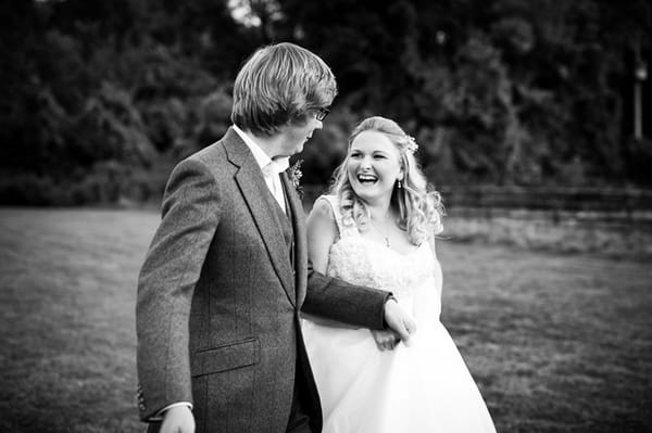 Bride and groom walking holding hands