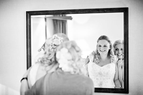 Bride looking in mirror