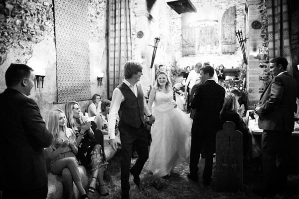 Groom leading bride to first dance