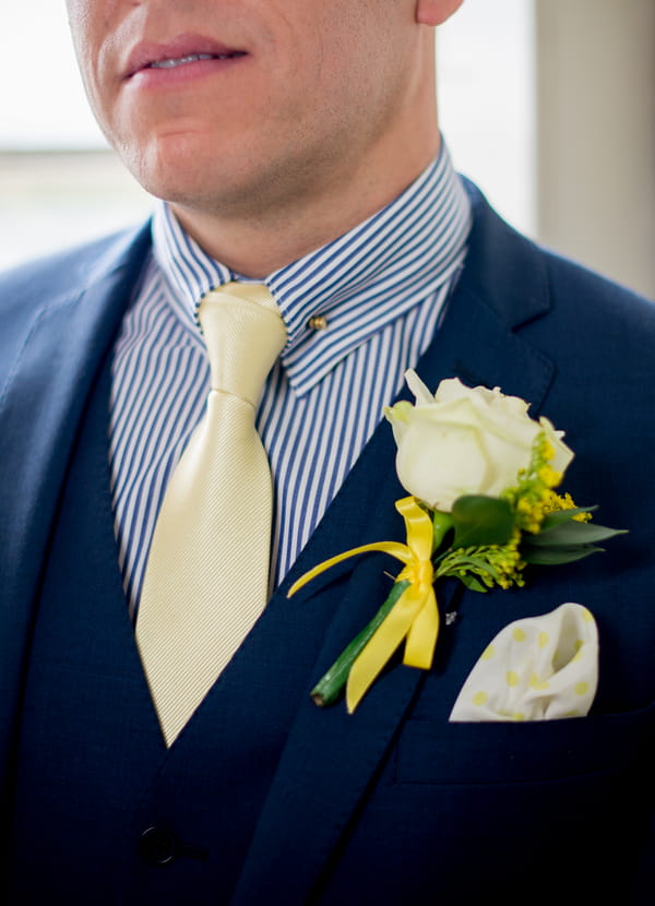 Groom's striped blue shirt and yellow tie