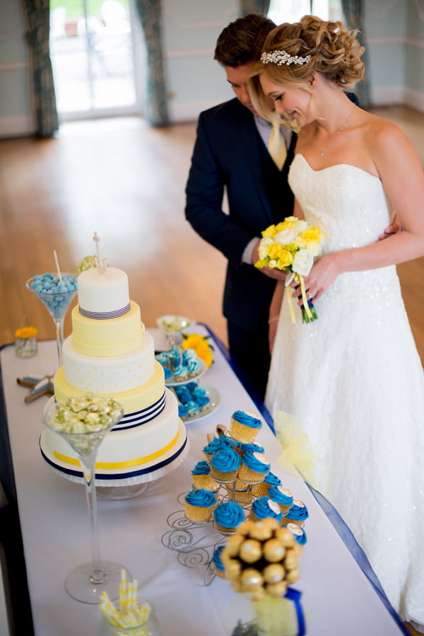 Bride and groom at cake table