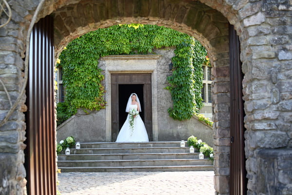 Bride on steps at Walton Castle