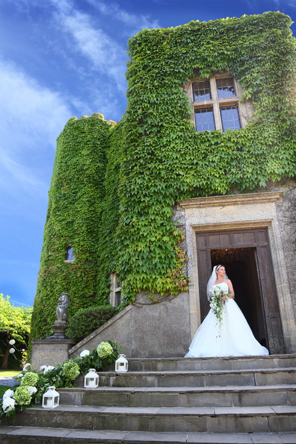 Bride on steps at Walton Castle