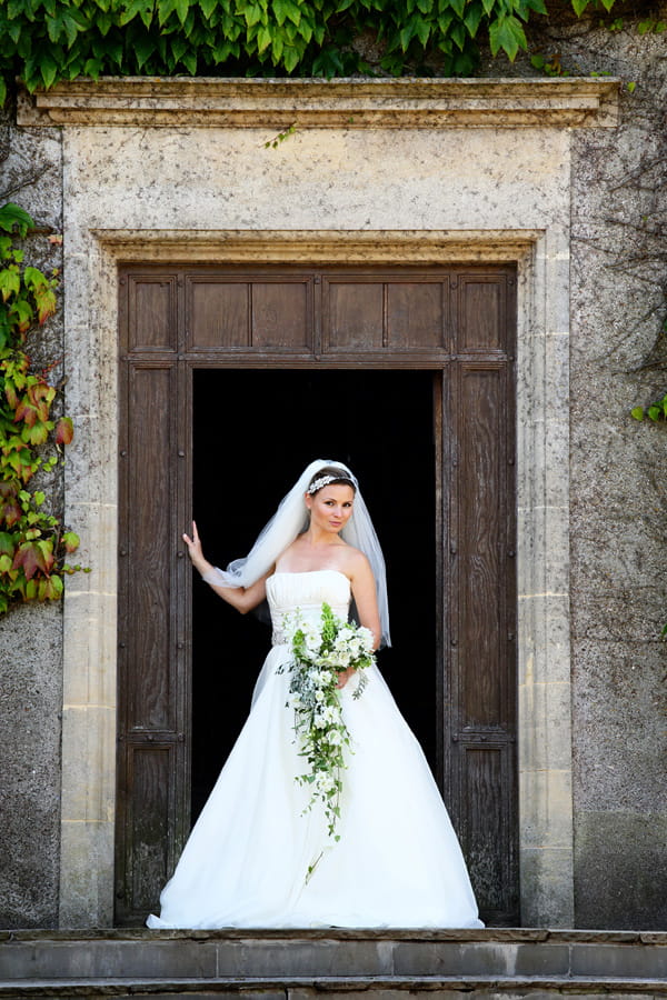 Bride standing at door of Walton Castle