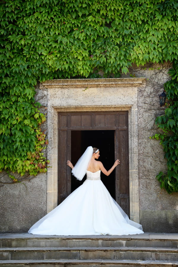 Bride standing in doorway of Walton Castle