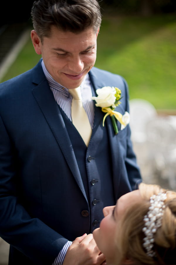 Groom looking down at bride