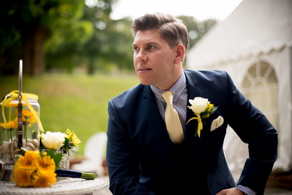 Groom sitting on chair