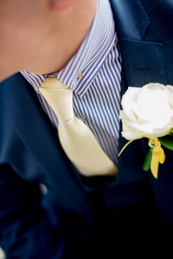 Groom's yellow tie and buttonhole