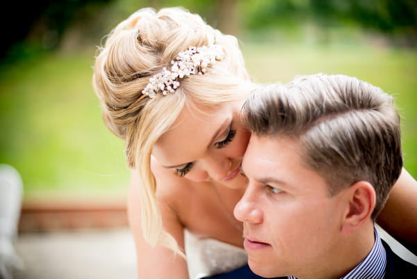 Bride leaning down to groom