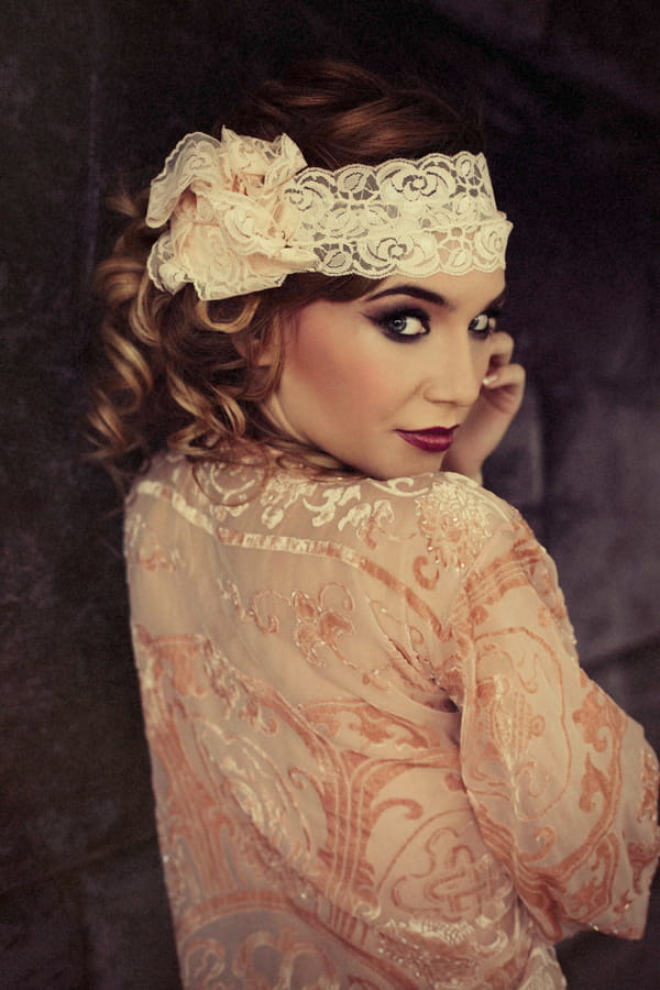 Woman wearing headband looking over shoulder - Bridal boudoir shoot