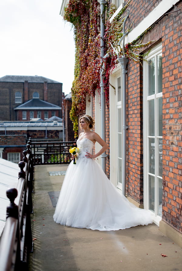 Bride standing on balcony