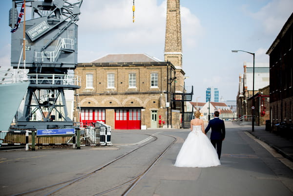 Bride and groom walking through The Dockyard Chatham