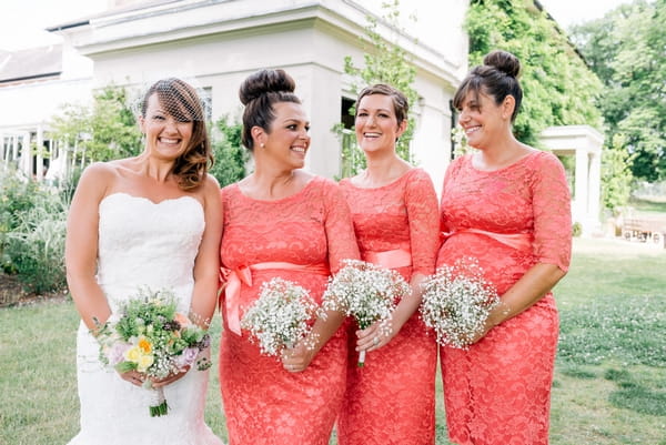 Bride and bridesmaids with bouquets by Louise Avery Flowers