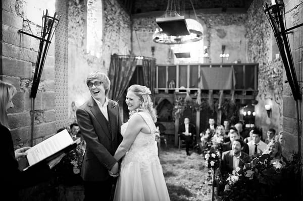 Bride and groom laughing during wedding ceremony