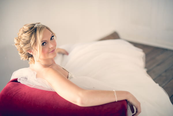 Bride leaning back on couch