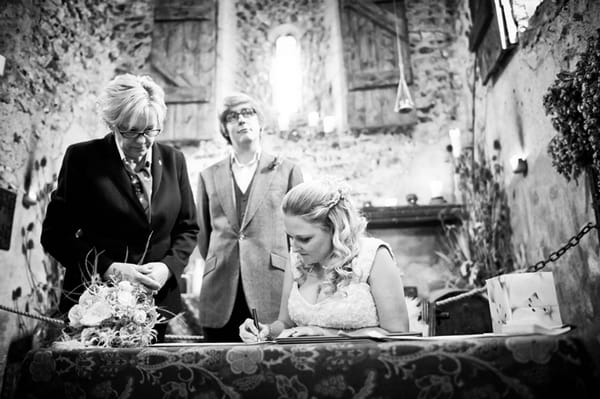 Bride signing register