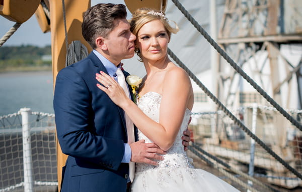 Bride and groom on ship deck