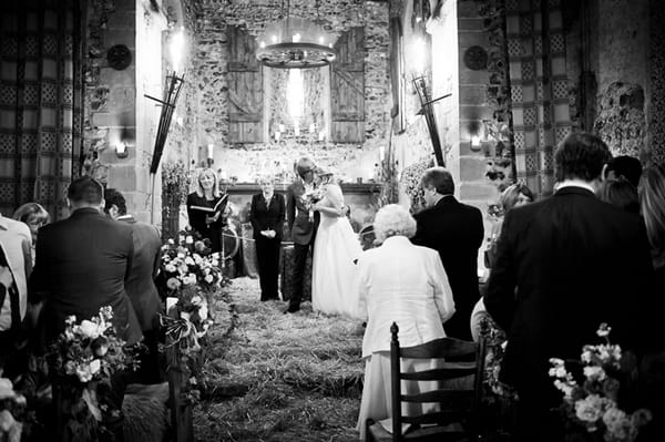 Groom kissing bride on the head