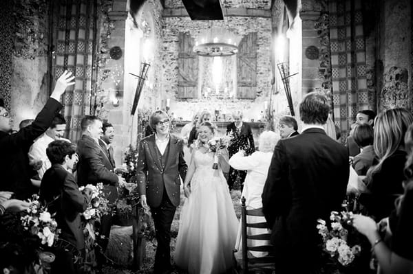 Bride and groom leaving wedding ceremony