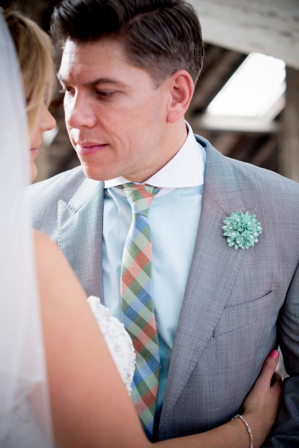 Groom with striped turquoise tie