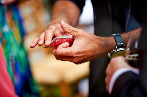 Magician holding cards