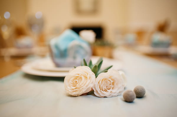Flowers and pebbles on table