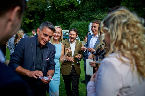 Wedding guests watching magic trick