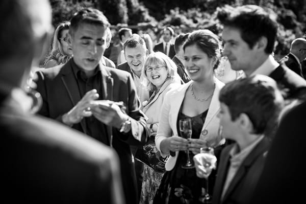 Wedding guests watching magic trick