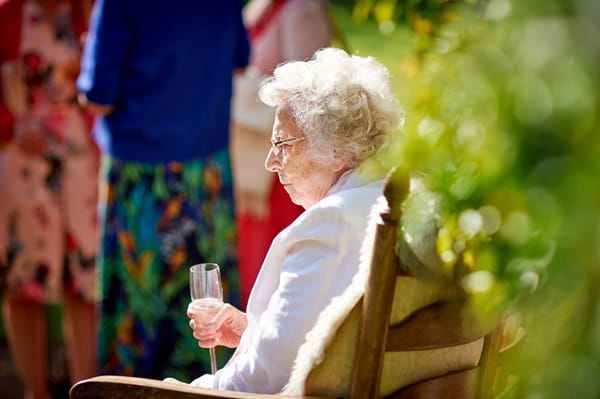 Elderly lady sitting on bench