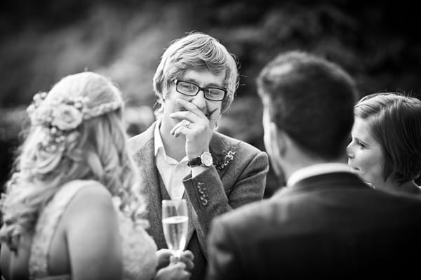 Groom laughing