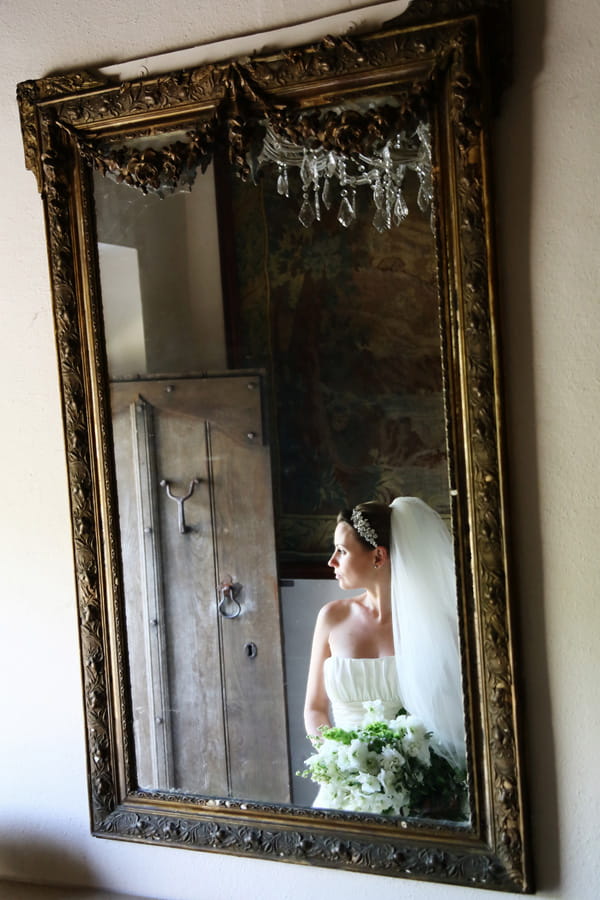 Reflection of bride in mirror